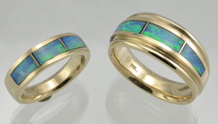 Blue and Green Australian Opal inlaid in 14KT yellow gold wedding bands by James Hardwick.