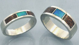 Matching wedding bands in sterling silver with dinosaur bone inlay