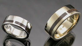 Matching wedding bands in 14KT white gold with petrified wood inlay by James Hardwick.