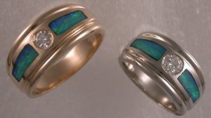 Custom made wedding bands in 14KT yellow and 14KT white gold with diamonds and opal.