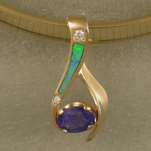 JM68-14KT slide with oval Tanzanite and diamonds.